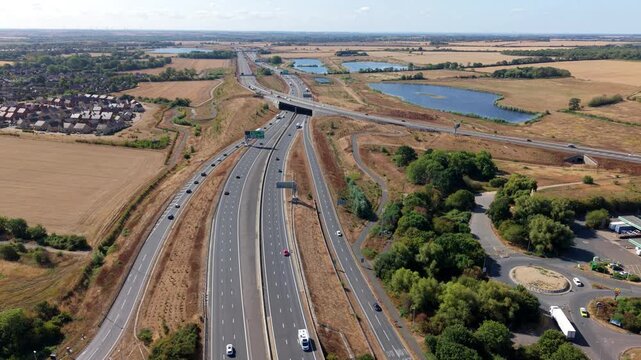 Aerial view of busy traffic flowing through a major motorway junction on the A1 road in the UK