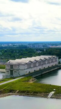 Vertical video. Rybinsk, Russia. Drone footage of the Rybinsk hydroelectric power plant. Drone footage, Point of interest. Rich colors