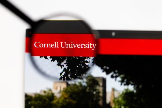 Milan, Italy 2026, 15 AGO Closeup of cornell university website page on a laptop screen. Focus on cornell university logo under a magnifying glass.