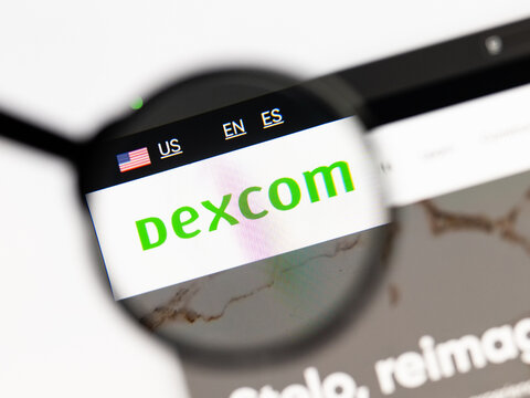Milan, Italy 2026, 15 AGO Closeup of dexcom website page on a laptop screen. Focus on dexcom logo under a magnifying glass.
