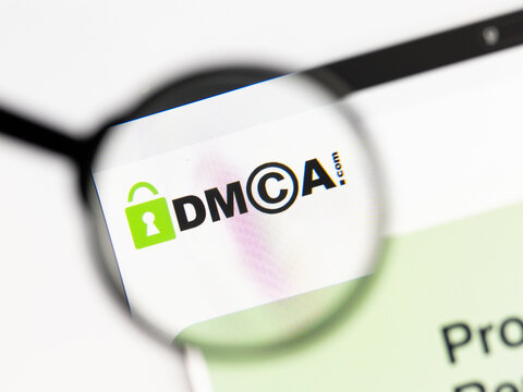 Milan, Italy 2026, 15 AGO Closeup of dmca website page on a laptop screen. Focus on dmca logo under a magnifying glass.