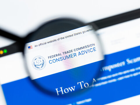 Milan, Italy 2026, 15 AGO Closeup of Federal Trade Commission FTC website page on a laptop screen. Focus on Federal Trade Commission FTC logo under a magnifying glass.
