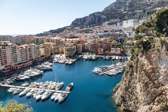 Monaco, Monaco - April 04, 2026: Elevated view of Port de Fontvieille marina with yachts, residential buildings and surrounding rocky hillsides.