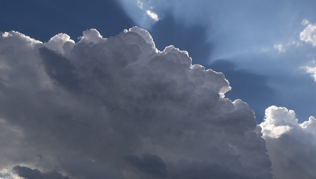 blue sky  white clouds and sunrays