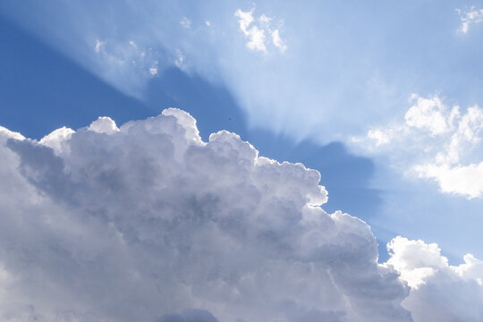 blue sky  white clouds and sunrays