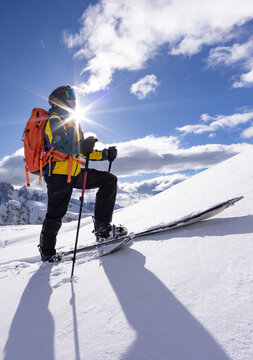 Winter Mountain Scenery with Man on Cross-Country Skis