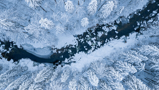 Clear Blue Winter River With Snow Covered Rocks
