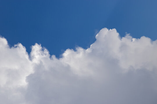 blue sky  white clouds and sunrays