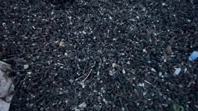 Assorted Used Automotive Spare Parts and Metal Components in Auto Salvage Yard, automotive repair, vehicle maintenance, recycling, industrial materials, and automobile spare parts concepts.
