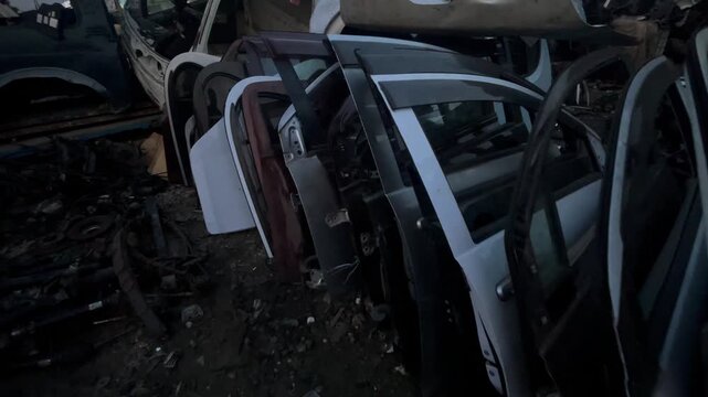 Used Car Doors and Automotive Body Parts in Auto Salvage Yard, automotive repair, spare parts, vehicle maintenance, and automobile recycling concepts