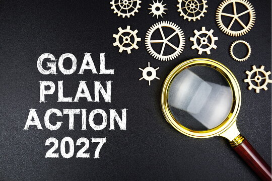 Goal, Plan Action 2027 text with magnifying glass on black background