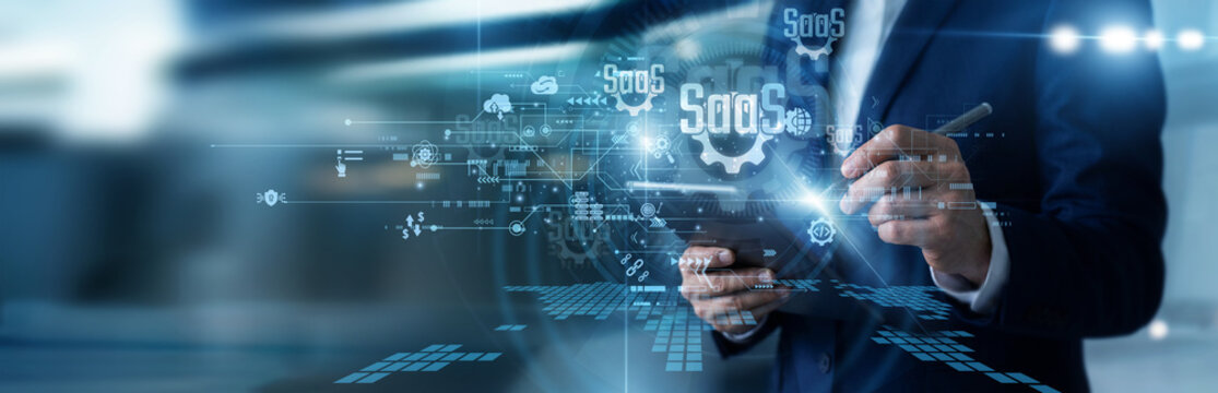 Product manager working on tablet monitoring Software as a Service subscription metrics, analyzing user retention data, managing cloud application deployments, and tracking monthly revenue.