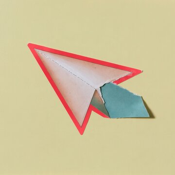 Cursor arrow sticker made of handmade torn paper with rough edges on a yellow background, for digital navigation and interface design concepts