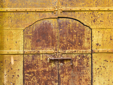 Weathered Metal Door with rust and lock