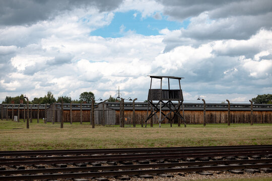 Oświęcim, Poland - July 20, 2026: Preserved barracks, guard towers, fencing and other structures at the former Auschwitz II-Birkenau Nazi concentration and extermination camp.