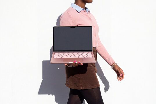 Woman Walking With Pink Laptop
