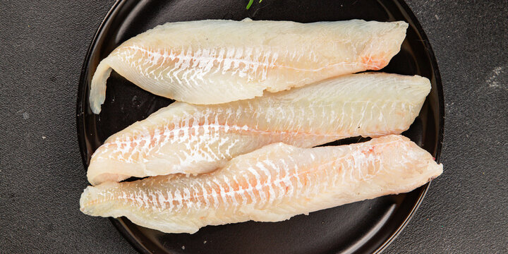 Sea bass fillet raw white fish, seafood healthy eating &nbsp;pescatarian diet healthful tasty dish, snack fresh gourmet rustic food background on the table top view copy space