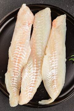 Sea bass fillet raw white fish, seafood healthy eating &nbsp;pescatarian diet healthful tasty dish, snack fresh gourmet rustic food background on the table top view copy space