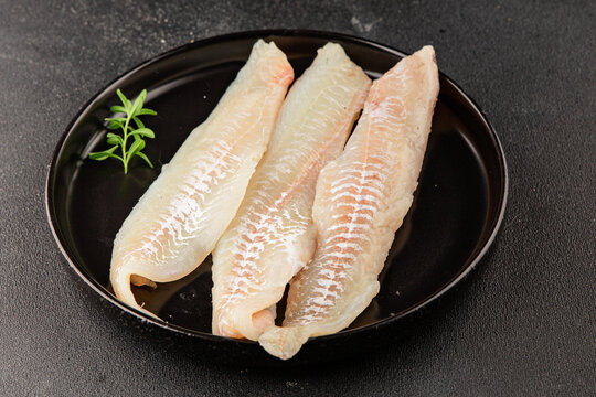Sea bass fillet raw white fish, seafood healthy eating &nbsp;pescatarian diet healthful tasty dish, snack fresh gourmet rustic food background on the table top view copy space
