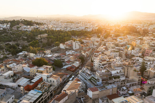 Athens cityscape with golden hour sunlight and Ancient Agora