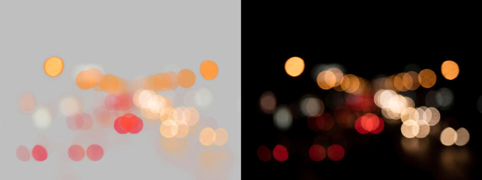 Abstract bokeh city lights, blurred night traffic background, glowing orange and red light orbs