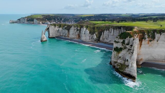 White cliffs and Aiguille d Etretat along Etretat coastline, France. Normandy natural landmarks and coastal scenery from drone