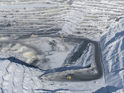 Aerial view of open pit coal mine in winter