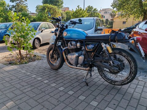 Rome, Italy &ndash; July 5, 2026: a Royal Enfield&mdash;the world's oldest motorcycle brand still in operation, founded in England in 1901 and now under Indian ownership&mdash;parked along a sidewalk.