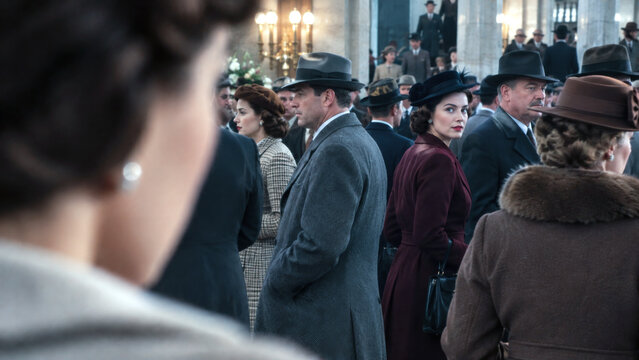 Crowd of elegantly dressed men and women in vintage 1940s fashion gathering inside a busy public building