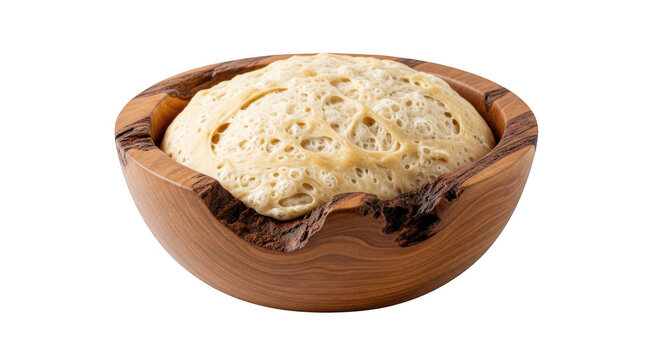 Sourdough starter bubbling in rustic olive wood bowl, active yeast fermentation for bread baking, organic liquid dough isolated on white