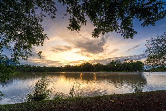 road landscape lake views and the reservoir the forest summer with evening blue dramatic sunset sky nature background.