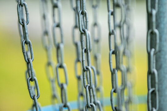 Closeup pattern of metal disc golf target chains.