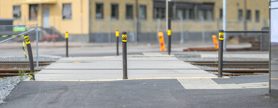 Pedestrian crossing pathway through newly built tram tracks.