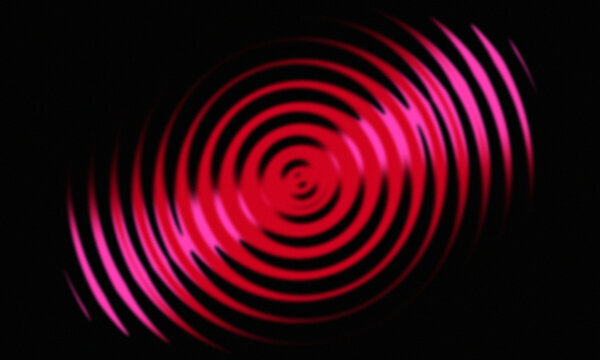 Abstract black background featuring concentric elliptical red and magenta rings that create a hypnotic optical illusion with a strong sense of depth and motion.