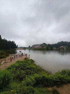 Mirik Sumendu Lake landscape with tourists in Darjeeling hills