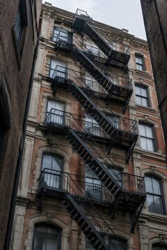 Metal fire escape across heritage facade