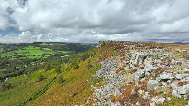 Rocks and Moorland over Curbar Edge and Hope Valley from a drone, Peak District National Park, Curbar, Calver, England, UK