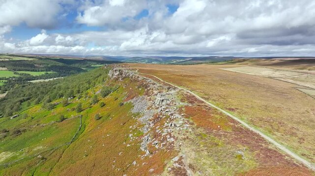 Rocks and Moorland over Curbar Edge and Hope Valley from a drone, Peak District National Park, Curbar, Calver, England, UK
