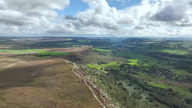 Rocks and Moorland over Curbar Edge and Hope Valley from a drone, Peak District National Park, Curbar, Calver, England, UK