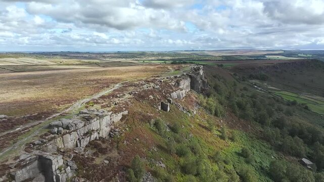 Rocks and Moorland over Curbar Edge and Hope Valley from a drone, Peak District National Park, Curbar, Calver, England, UK