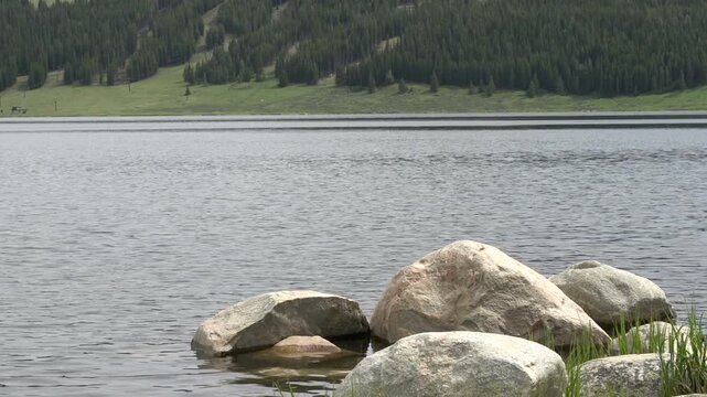 Rocks in front of lake water
