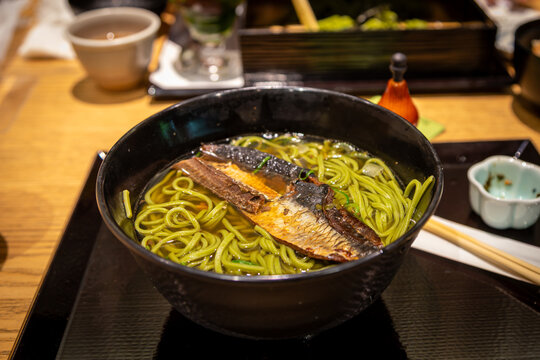Nishin Cha-Soba, a traditional Japanese dish featuring green tea buckwheat noodles topped with simmered herring fillet. It is is one of the most culturally significant and beloved Kyoto comfort food.