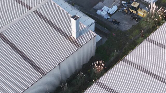 Aerial view of industrial warehouse metal roofs