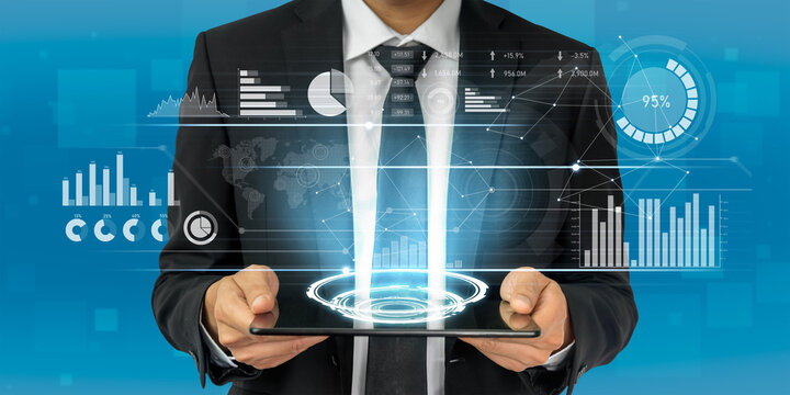 Businessman Holding Tablet with Digital Data Visualization Concepts, Modern Technology Interface, Charts and Graphs in Blue Background, Future Business Insights Scalp.
