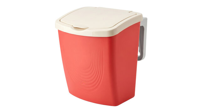 Red plastic hanging trash can with white lid, compact kitchen waste bin for cabinet doors, portable wall-mounted garbage container isolated on white