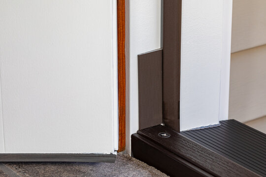 Exterior door jamb weatherstripping and corner seal. Home maintenance, repair and energy savings concept.