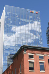 Obraz premium wordmark signage at the top of Google King East, a corporate office, located at 65 King St E, Toronto