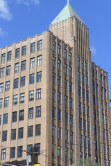 Obraz premium roofline and pyramidal tower at Tower Building designed by Benjamin Brown in Art Deco style located at 110 Spadina Av Garment District, Toronto