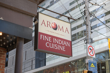 Obraz premium projecting sign outside Aroma Fine Indian Cuisine located at 287 King St W, Toronto