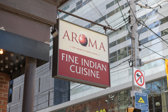 projecting sign outside Aroma Fine Indian Cuisine located at 287 King St W, Toronto